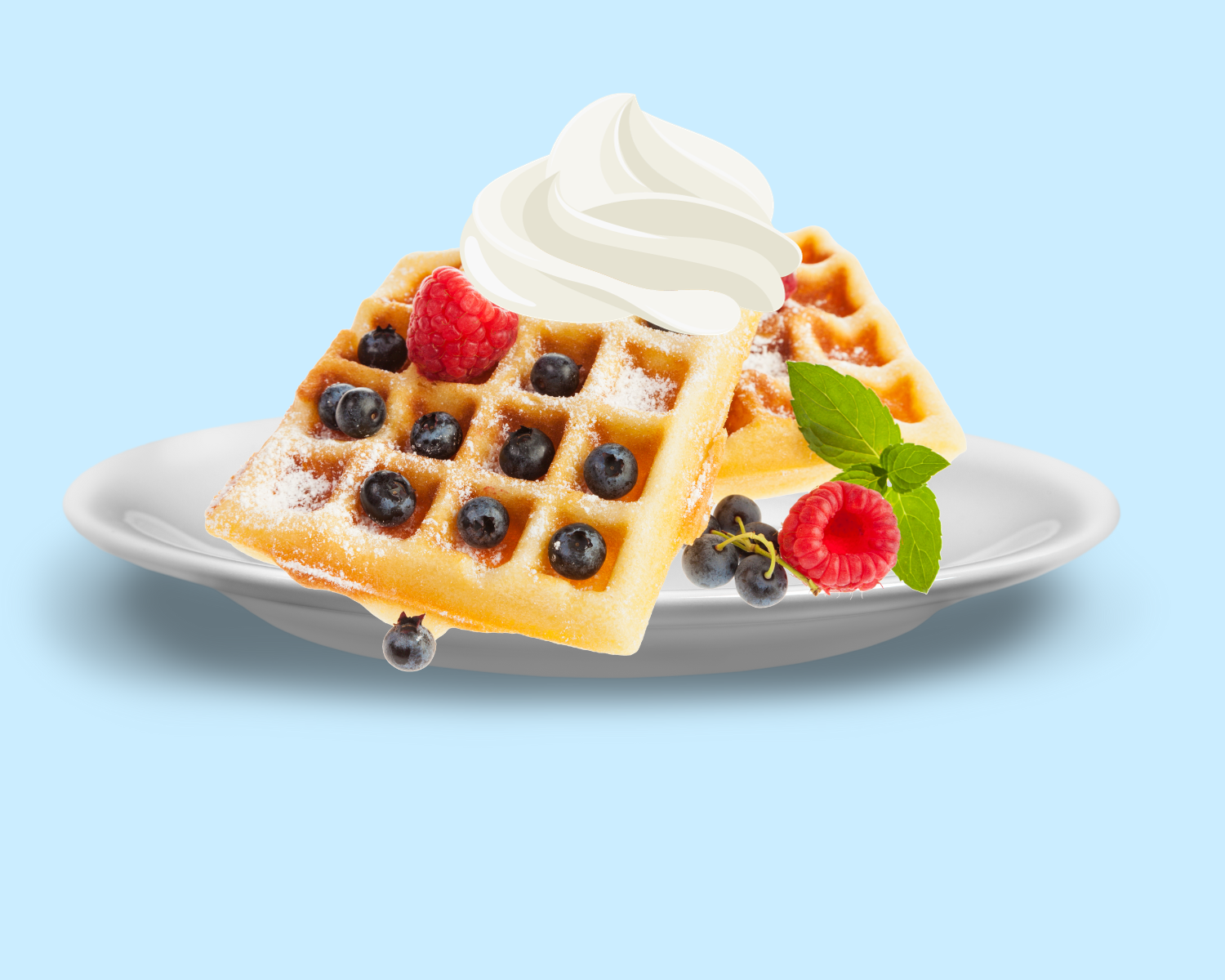 Picture of waffles with berries and whipped cream on top.